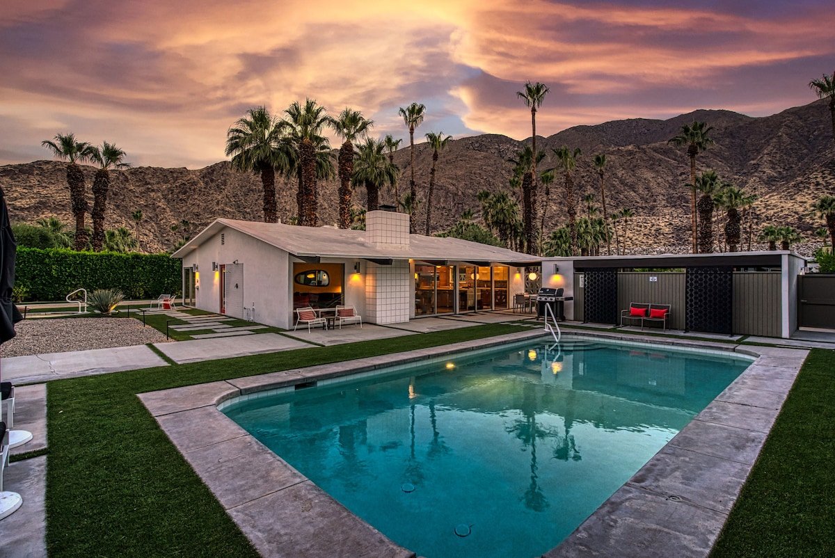 Pool at a home in Cathedral City Cove at sunset with mountains behind