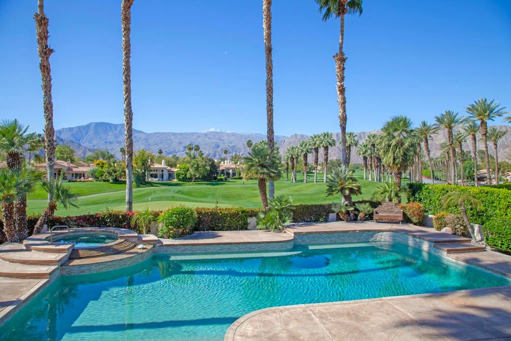 Pool and spa facing a palm-lined fairway during pool leak detection in Date Palm Country Club