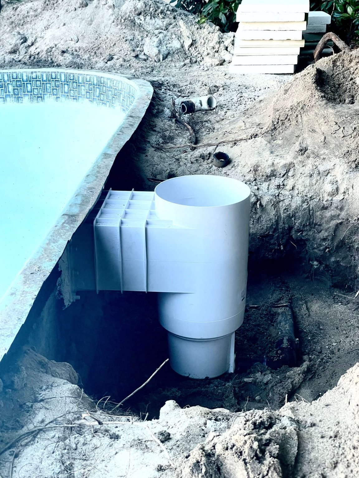 New skimmer being set in place during a repair at a Cathedral City pool