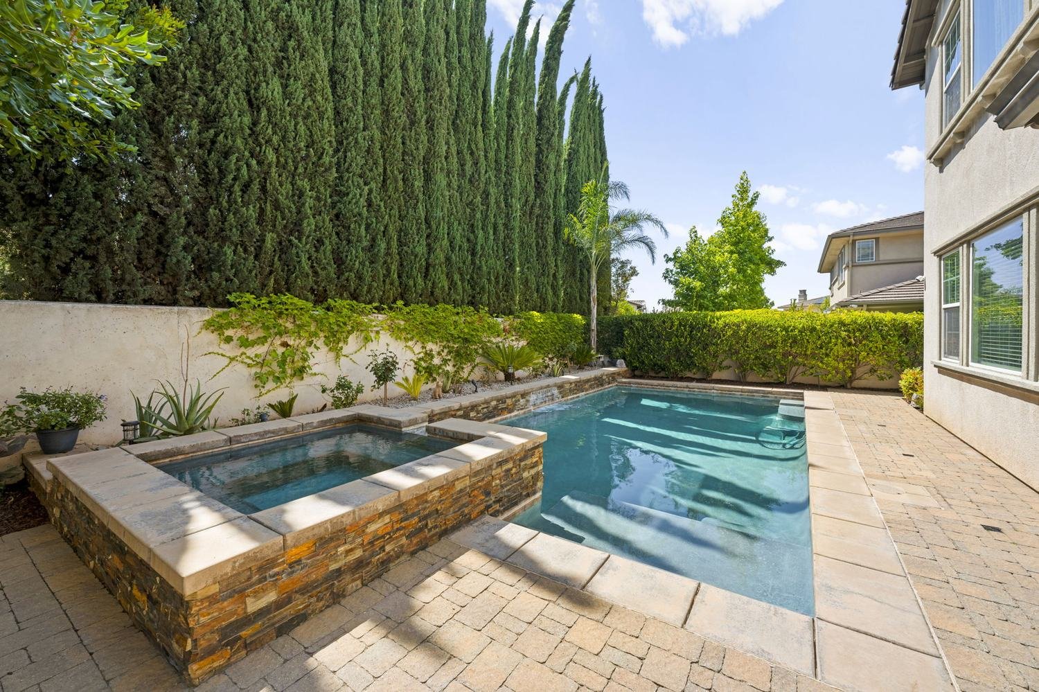 Raised spa beside a pool at a home in Cathedral City